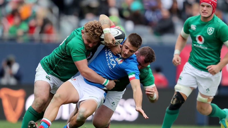 Luca Sperandio is tackled by Finlay Bealham and Dave Kilcoyne during Ireland’s win over Italy in Chicago. Photograph: Dan Sheridan/Inpho