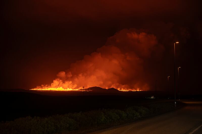 The eruption was seen from the intersection between Reykjanesbraut and the road to Grindavik. Photograph: Marco di Marco/AP