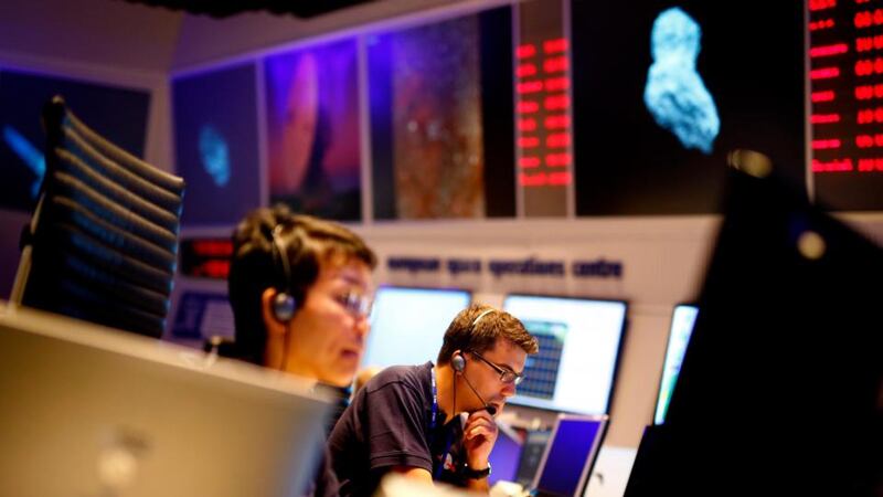 Scientists and mission control workers check their monitors at the European Space Agency’s (ESA) main control room in Darmstadt today. Launched ten years ago, the ESA’s Rosetta spacecraft will reach comet 67P/Churyumov-Gerasimenko today. Photograph: Reuters