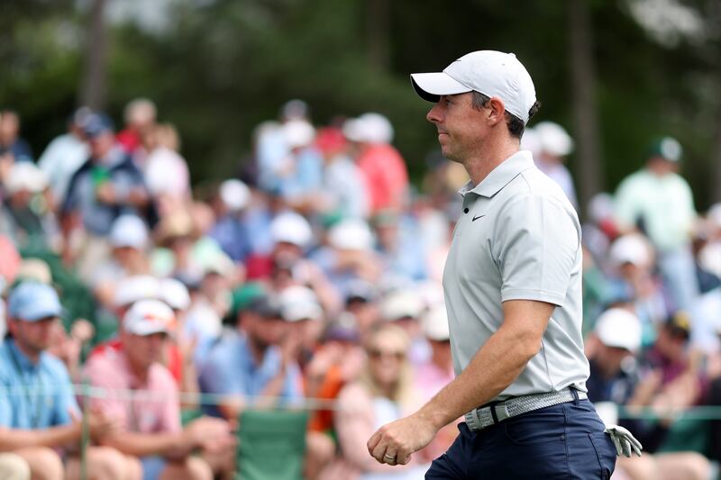 Rory McIlroy walks off the 18th green after carding a 77 in his second round. Photograph: Christian Petersen/Getty Images