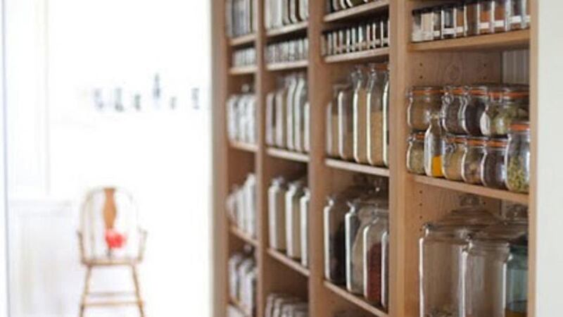 These shallow shelves  are just deep enough to take tins, bottles and spices and create a kind of larder, freeing up kitchen cupboards