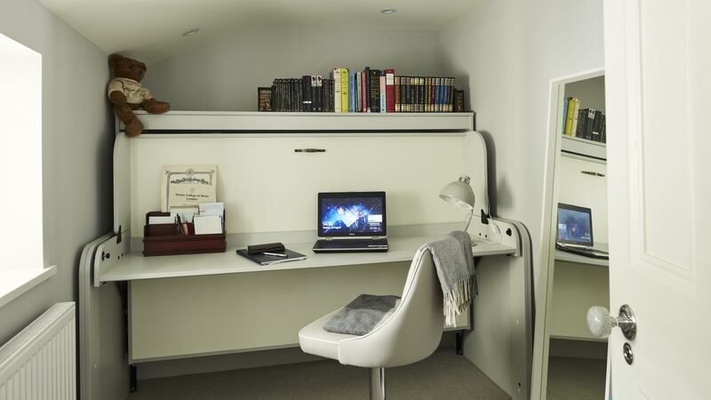 The desk folds down into a bed. Photograph: Philip Lauterbach