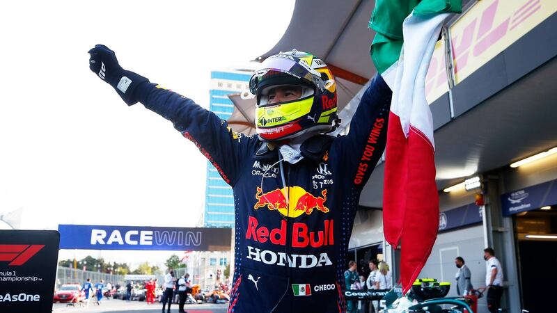 Sergio Perez waves a Mexican flag  in parc ferme after winning the  F1 Grand Prix of Azerbaijan at Baku City Circuit. Photograph:  Maxim Shemetov/Getty Images