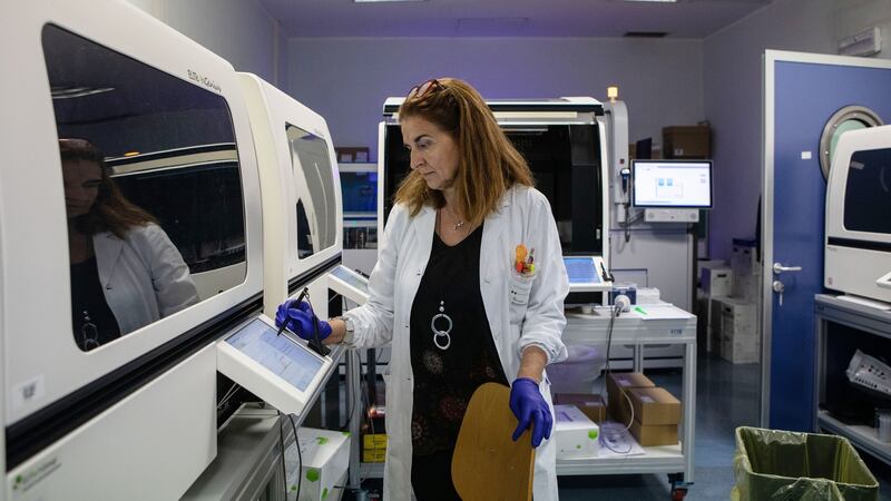 Doctor Diana Fanti works during a swab test process in the molecular biology laboratory of the Ospedale Niguarda hospital  in Milan on March 5th. The number of confirmed cases in the country exceeds 12,000, and it is still not clear when the cases will peak. Photograph: Emanuele Cremaschi/Getty Images
