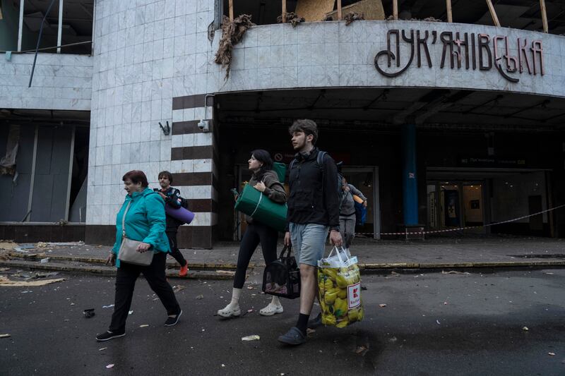People with their belongings leave a damaged metro station after a Russian attack in Kyiv last week. Photograph: Oleksii Filippov/AFP 