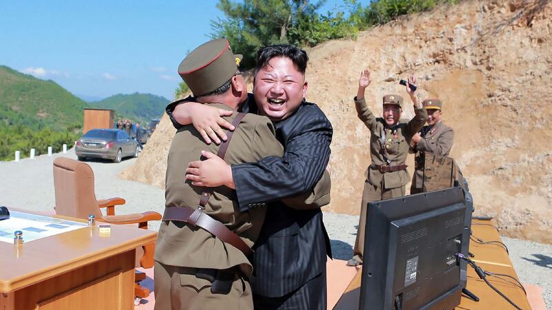 Kim Jong-un celebrating the successful test-fire of intercontinental ballistic missile Hwasong-14. Photograph: STR/AFP/Getty Images