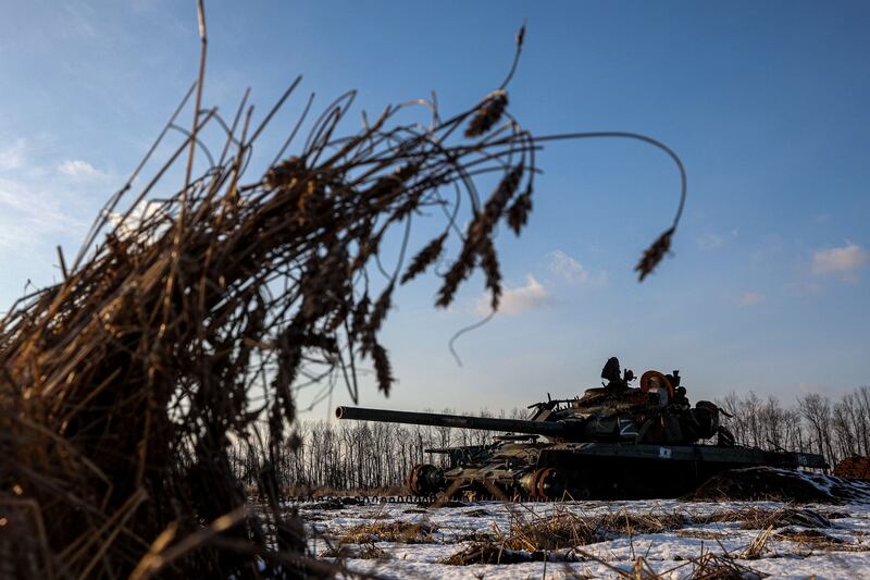 A destroyed Russian tank sits in a snow covered wheat field in Kharkiv region. Photograph: Anatolii Stepanov/Getty Images