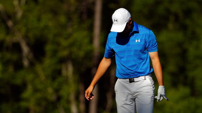 Jordan Spieth  reacts after hitting his tee shot into the water on the 12th hole during the final round of the 2016 Masters  at Augusta National Golf Club. Photograph: Kevin C Cox/Getty Images