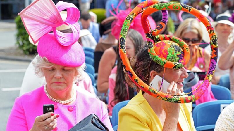 Carmel Dalton (left) from Ballsbridge, and Sarah McGahon from  Bray, Co Wicklow, enjoying the sun at Ladies Day. Photograph: Eric Luke / The Irish Times