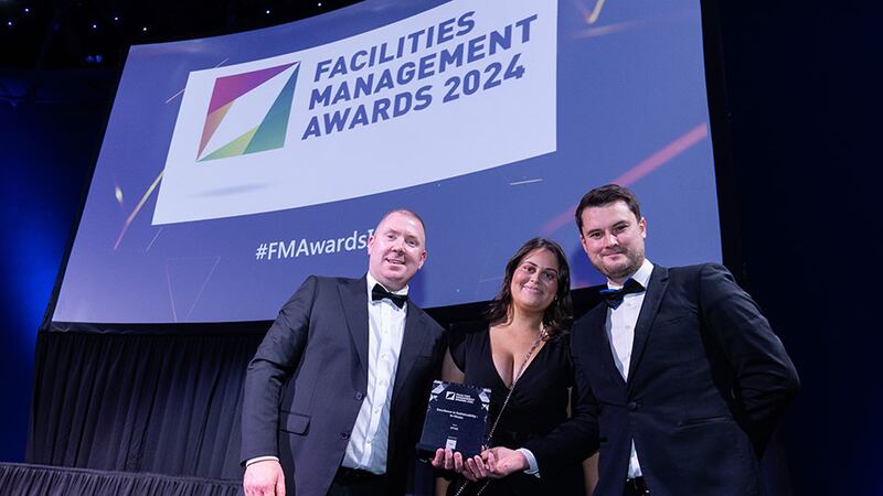 Dinny Crowe, enterprise operations director, UK & Ireland of CBRE, presents the excellence in sustainability – in-house award to Shane Faulkner and Siobhan Pierce, KPMG