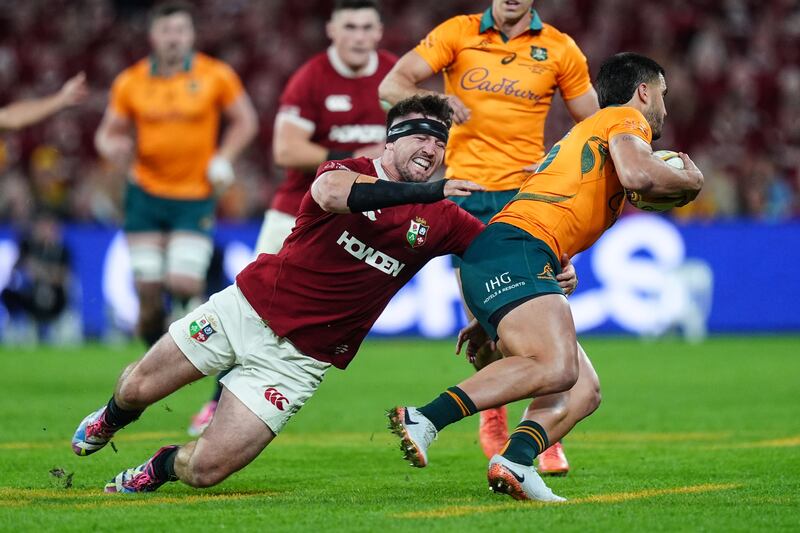 Tom Curry tackles Australia fullback Tom Wright during the first Test. Photograph:  David Davies/PA Wire