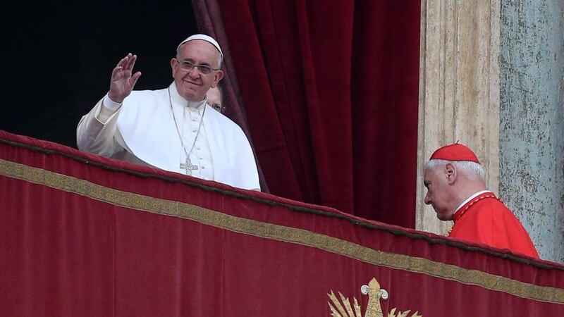 Pope Francis waves to the faithful as he delivers the traditional Urbi et Orbi (to the city and to the world) Christmas Day message from the central balcony of St. Peters Basilica in Vatican City. Photograph: Alessandro Di Meo/EPA