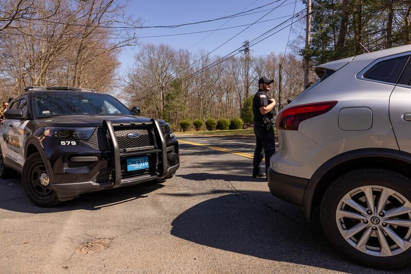  Police block a road near the home of Jack Teixeira, who investigators believe is linked to a trove of leaked classified US intelligence documents. Photograph: Alex Gagne/The New York Times)                      