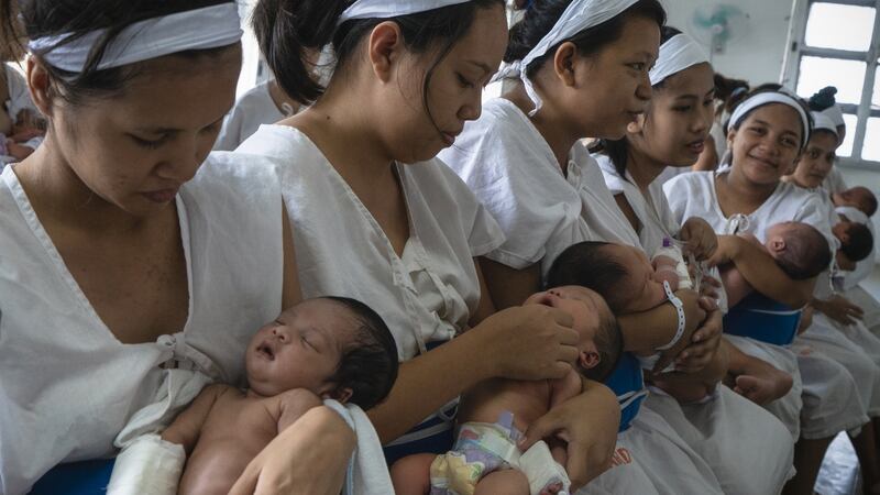 Patients who have just given birth line for a checkup inside a ward in Fabella Hospital in Manila on October 21st, 2018.  Photograph: Kimberly dela Cruz