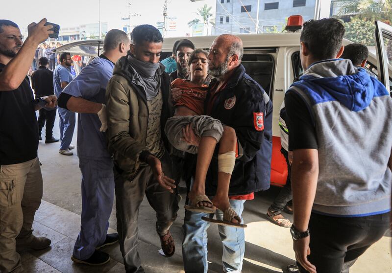 An injured Palestinian arrives at Nasser Medical Hospital in Khan Younis. Photograph: Yousef Masoud/The New York Times
                      