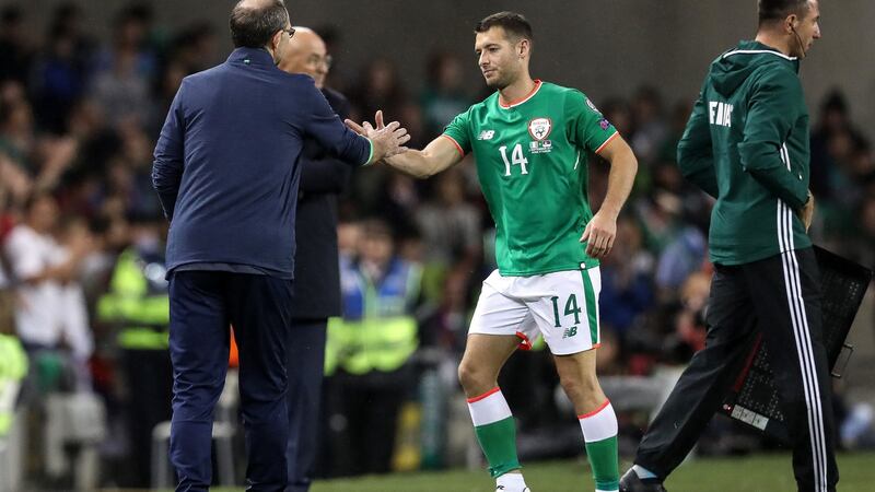 Hoolahan shakes hands with O’Neill after coming off against Serbia last September. Photo: Ryan Byrne/Inpho