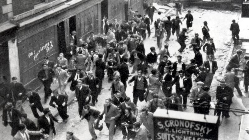 Battle of Cable Street: An anti-Fascist crowd, some of them carrying missiles, ran from a barricade they had erected near Aldgate as police charge. Photograph:  Jewish Chronicle/Heritage Images/Getty Images