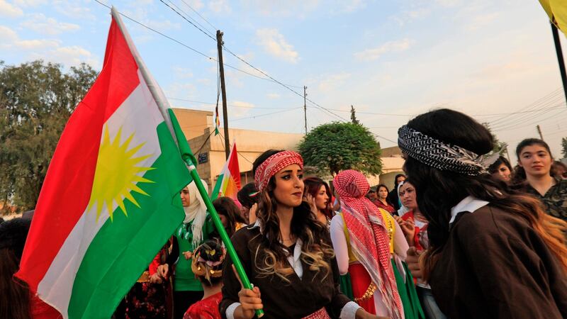 Syrian Kurds dance with the Kurdish flag as they celebrate in the northeastern Syrian city of Qamishli on September 25th, 2017, in support of the independence referendum in Iraq’s autonomous northern Kurdish region. Photograph: Delil souleiman/AFP/Getty Images