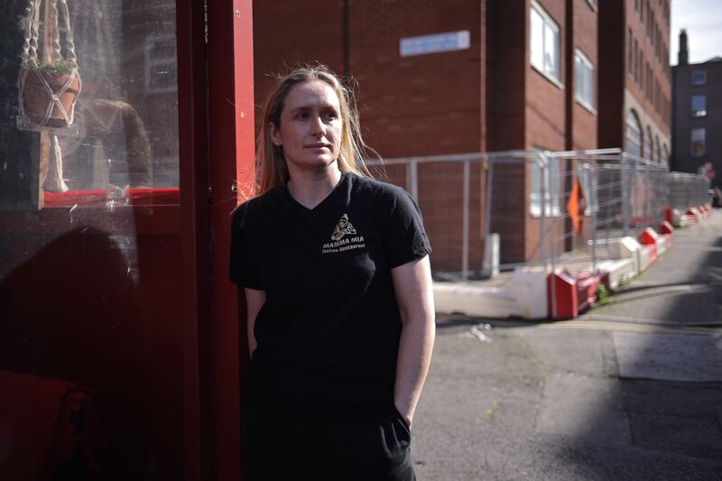 Ruth Hamilton, owner of the Mamma Mia restaurant, is looking for answers on when the the fencing along Mount Street will be removed, one year on from the IPO crisis. Photograph: Chris Maddaloni/The Irish Times