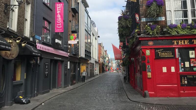 A deserted Temple Bar during lockdown with pubs and restaurants closed
