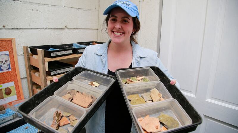 Maddie  Harris with  “finds” from the archaeological dig at the Norman settlement in the National Heritage Park, Co   Wexford.  Photograph Nick Bradshaw