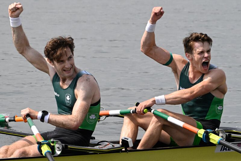 Ireland's Fintan McCarthy (right) and Paul O'Donovan celebrate winning their Olympic gold medal in the lightweight men's double sculls. Photograph: Olivier Morin/AFP via Getty Images