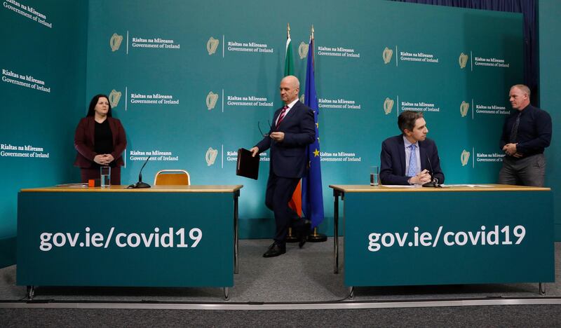 Bernadette Ferguson (left) and Michael Feeney (far right), along with chief medical officer Dr Tony Holohan and Minister for Health Simon Harris at the Government Buildings Press Centre in Dublin. Photograph: Leon Farrell/Photocall Ireland/PA
