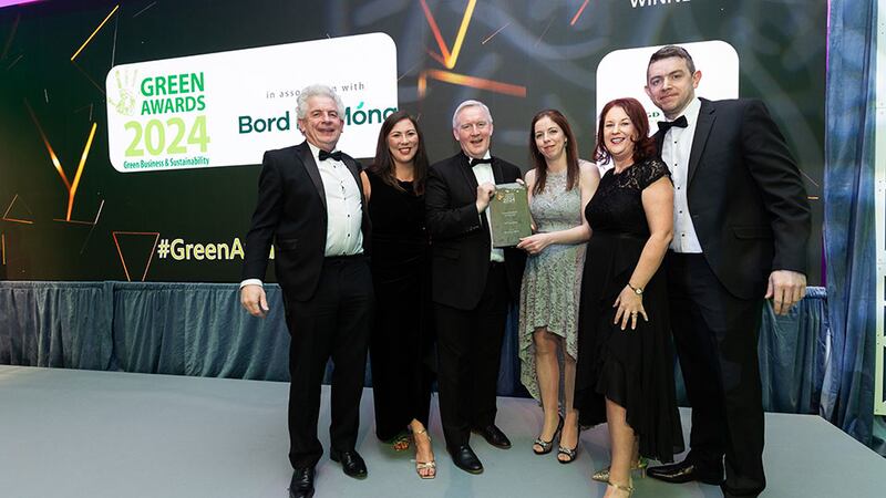 John Reilly, head of renewable energy at Bord na Móna, presents the green business of the year award to DGD Shredding Team