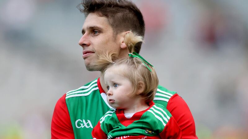 Lee Keegan with his daughter Lile at Croke Park:  The Mayo veteran  had total certainty about what was needed and he went out and showed it. You can’t say that for some of the other Mayo players. Photograph: James Crombie/Inpho