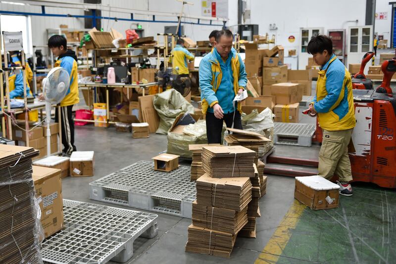 Workers prepare packages for delivery ahead of the Singles' Day shopping festival at a logistics center in Nanjing, in China's eastern Jiangsu province. Photograph: STR/AFP/Getty