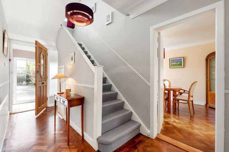 The hallway, diningroom and sittingroom all have parquet flooring