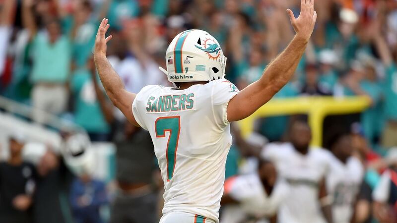 Miami Dolphins kicker Jason Sanders  celebrates after kicking the game winning field goal in overtime.