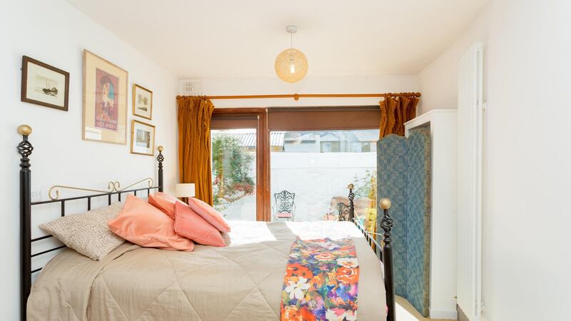 Currently set up as a bedroom, this light-filled space to the rear at 2 Eden Road Lower in Glasthule could make a second living room or eat-in kitchen cum den.