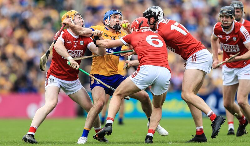 Clare's Shane O'Donnell is surrounded by Niall O'Leary, Ciaran Joyce and Ger Mellerick of Cork. Photograph: Evan Treacy/Inpho