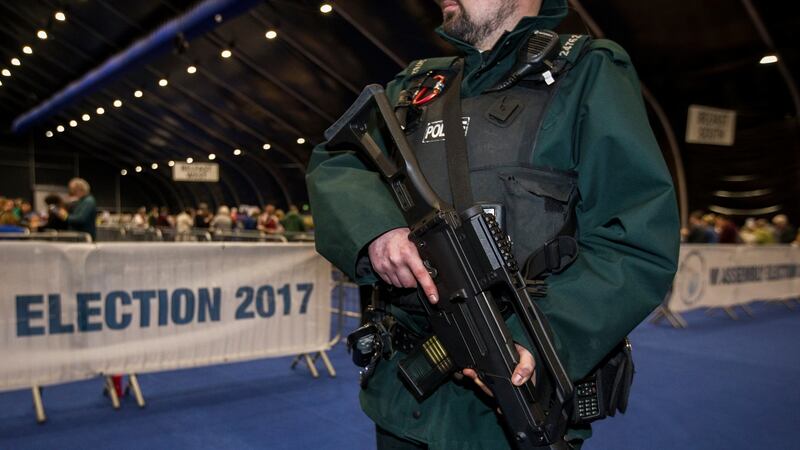 A PSNI officer patrols at the Belfast count centre on Friday night. Photograph: Liam McBurney/PA