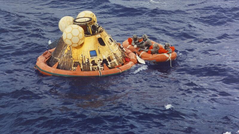 The three Apollo crewmen, Neil Armstrong, Michael Collins, and Edwin ‘Buzz’ Aldrin await a navy helicopter from the USS Hornet after the Apollo 11 lunar mission splashdown in the Pacific Ocean. Photograph: Nasa/Underwood Archives/Getty Images