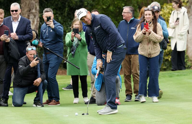 Golfer Pádraig Harrington takes the first putt at the opening on Friday of Marlay Park's 18-hole putting green, which he designed. Photograph:  Laura Hutton/The Irish Times