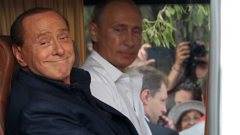 Silvion Berlusconi and Russian president Vladimir Putin, in Crimea in 2015.  Earlier this year, Berlusconi gave Putin a birthday present: a duvet cover featuring the two old pals shaking hands. Photograph:  Sasha Mordovets/Getty Images