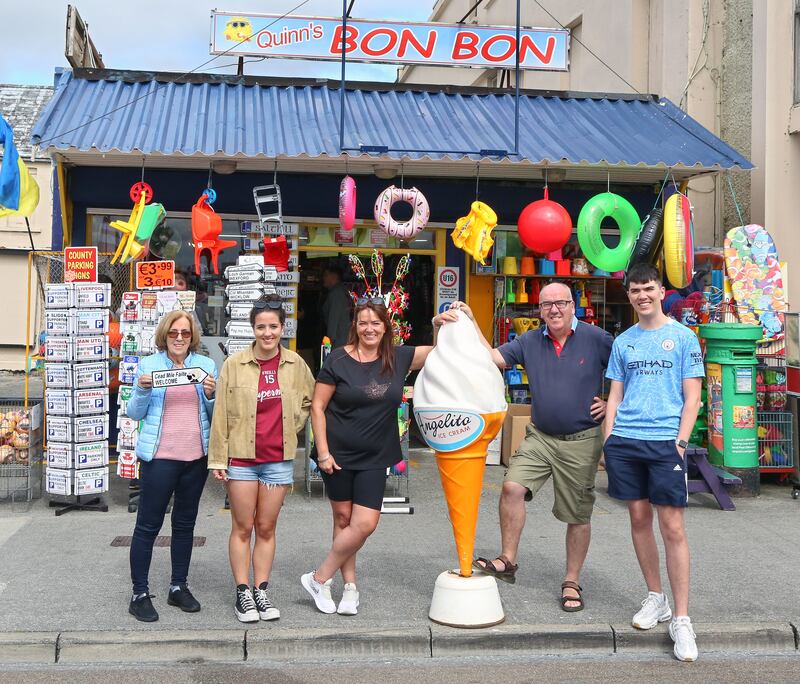 Yvette and Joe Quinn with their daughter Andrea, son Stephen and Joe's sister Anne (left), at the front of Quinn's Bon Bon summer shop in Salthill. Photograph: Joe O'Shaughnessy