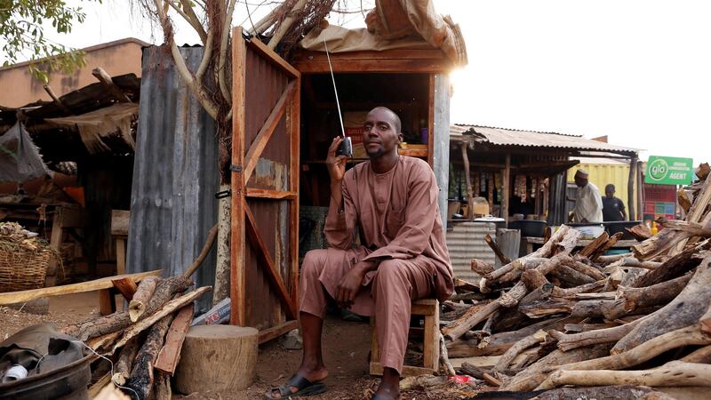 A man listens to the radio as Nigerians await the result of the presidential election, in Yola, Adamawa State, Nigeria. Photograph: Nyancho NwaNri/Reuters