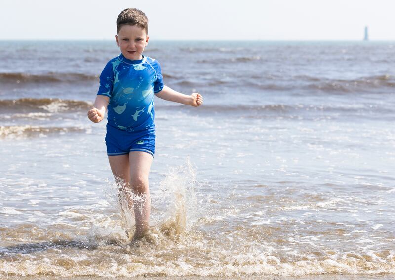 Cian (6) from Dublin enjoying the sunshine on Dollymount Stand, Dublin. Photograph: Collins