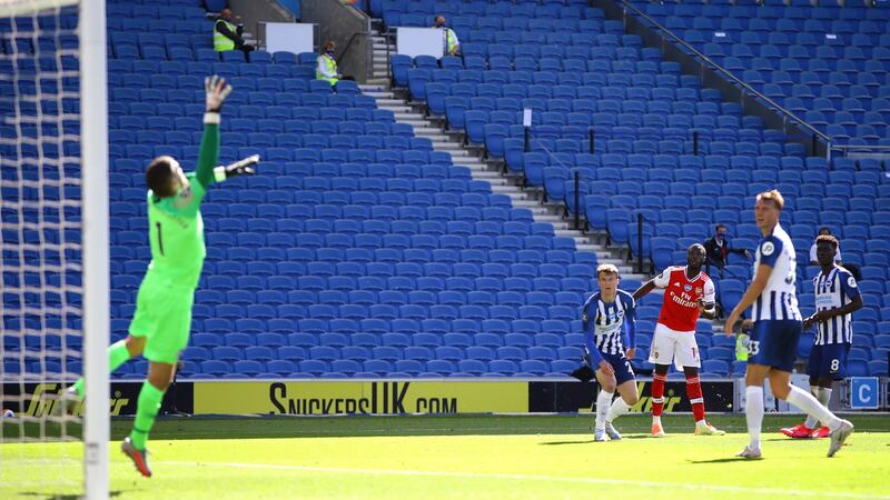 Nicolas Pepe scores the opener for Arsenal against Brighton. Photograph: Getty Images