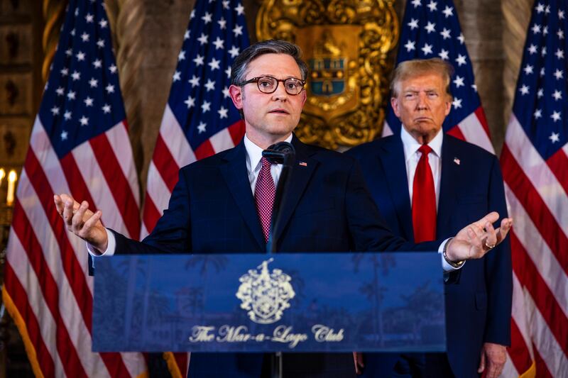Mike Johnson speaks alongside former US president Donald Trump at Mar-a-Lago, Trump's private club and residence in Florida, after their meeting there on April 12th. Photograph: Saul Martinez/New York Times
                      