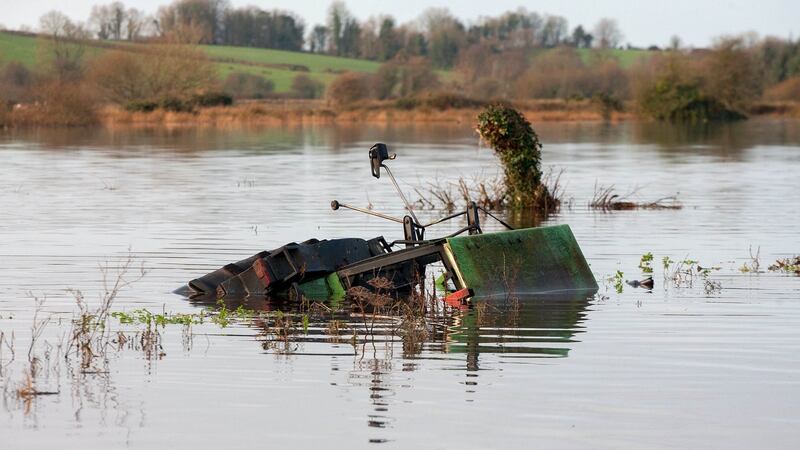 A submerged tractor near the village of Feakle, Co Clare after the onslaught of Storm Desmond. Photograph: Arthur Ellis