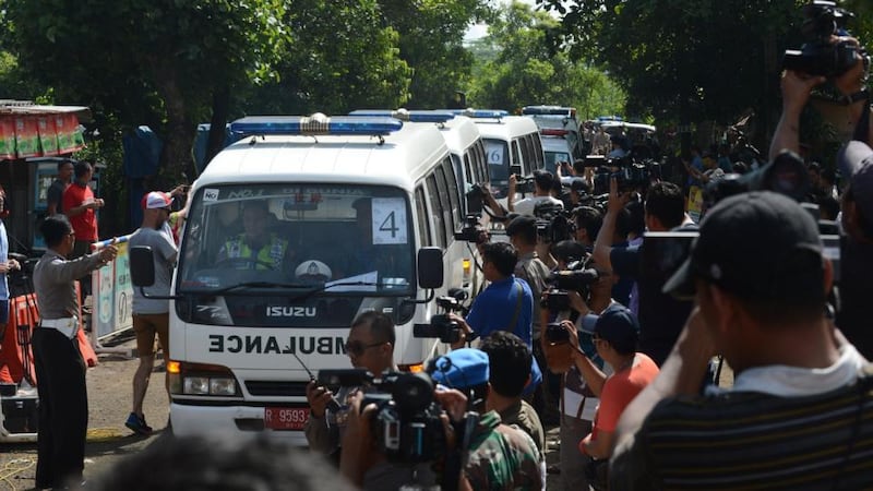 A convoy of ambulances carrying coffins arrives in Nusakambangan port in Cilacap located across from Nusakambangan maximum security prison island. Photograph: Romeo Gacadromwo Gacad/AFP/Getty Images