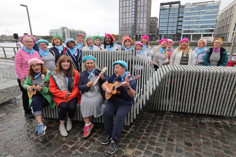 Rhona Byrne with members of the The Liffey Loves Choir at the bench on Sunday. Photograph: Alan Betson/The Irish Times