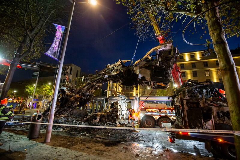 View of Dublin City Centre after night of rioting. A view a burnt out bus and luas on O'Connell Street. Photograph: Tom Honan 