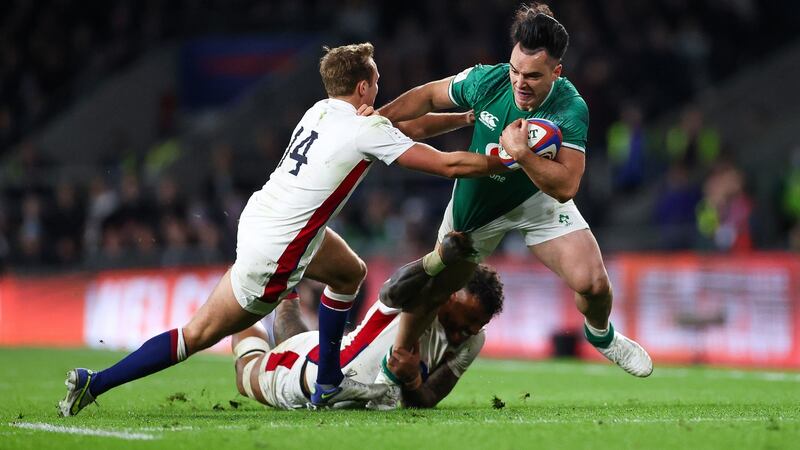 Ireland’s James Lowe is tackled by  Courtney Lawes and Max Malins of England during the  Guinness Six Nations match at Twickenham. Photograph:  James Crombie/Inpho