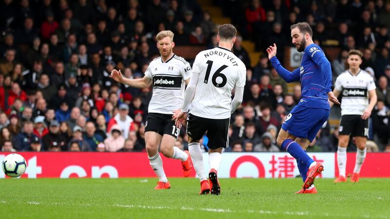 Gonzalo Higuain scores Chelsea’s opener at Craven Cottage. Photograph: Catherine Ivill/Getty