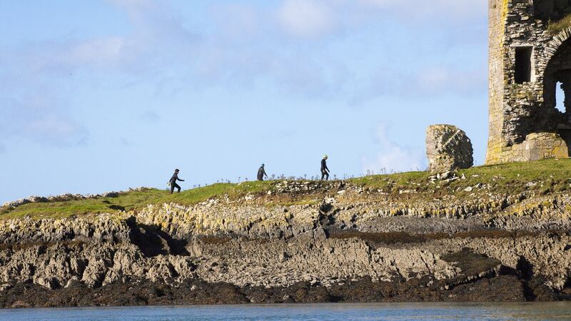 Clambering on top of Fenit Island. Photograph: Wild Water Adventures